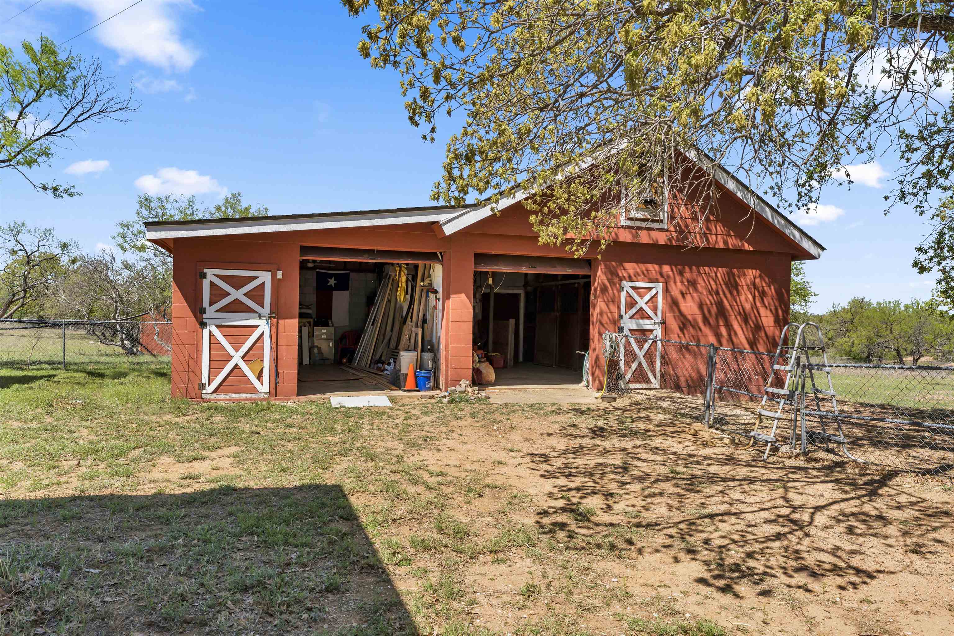 301 Wood Forest Road Kingsland, TX 78639 - Photo 22 of 32 a view of a house with a yard