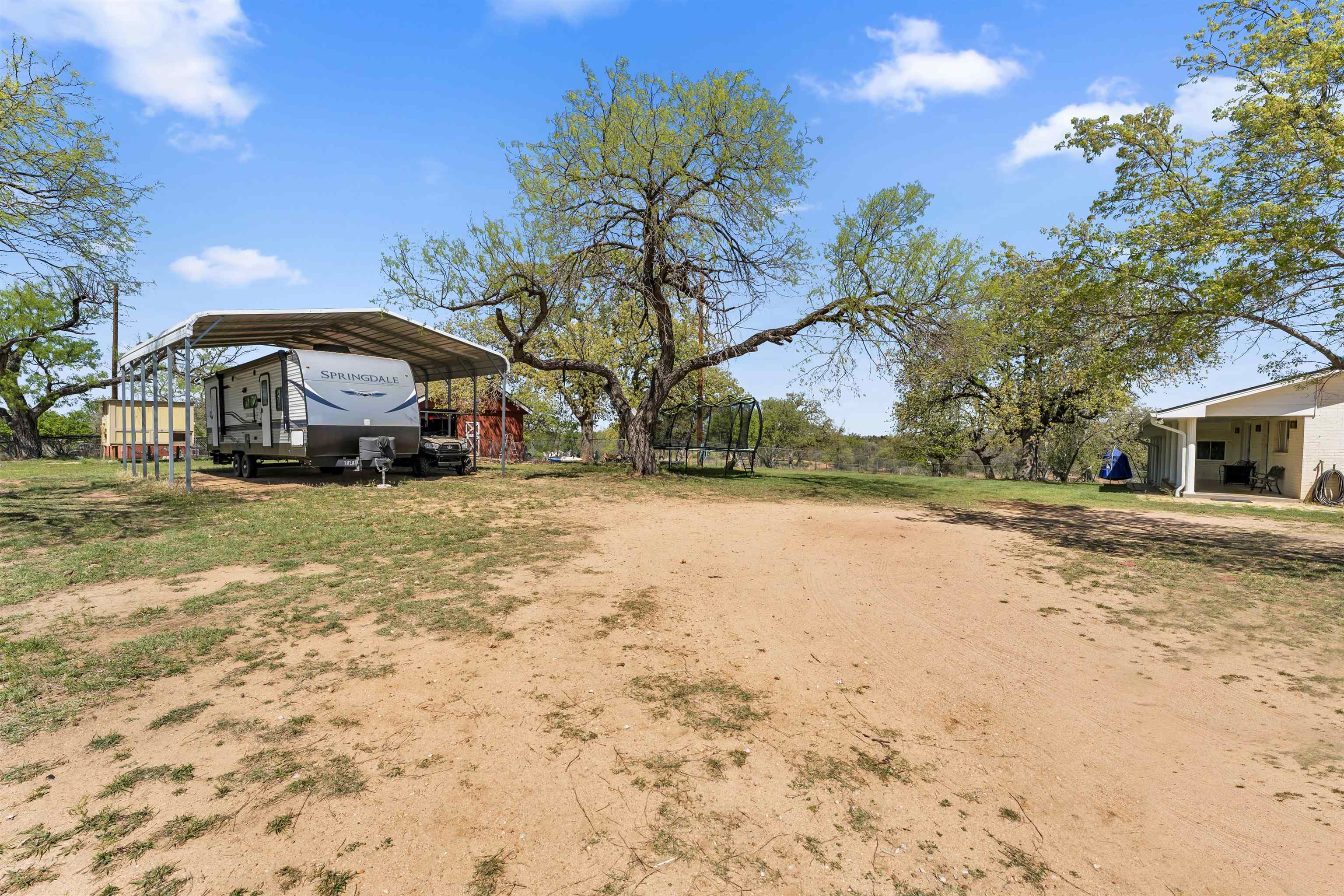 301 Wood Forest Road Kingsland, TX 78639 - Photo 29 of 32 a front view of a house with a yard covered with snow