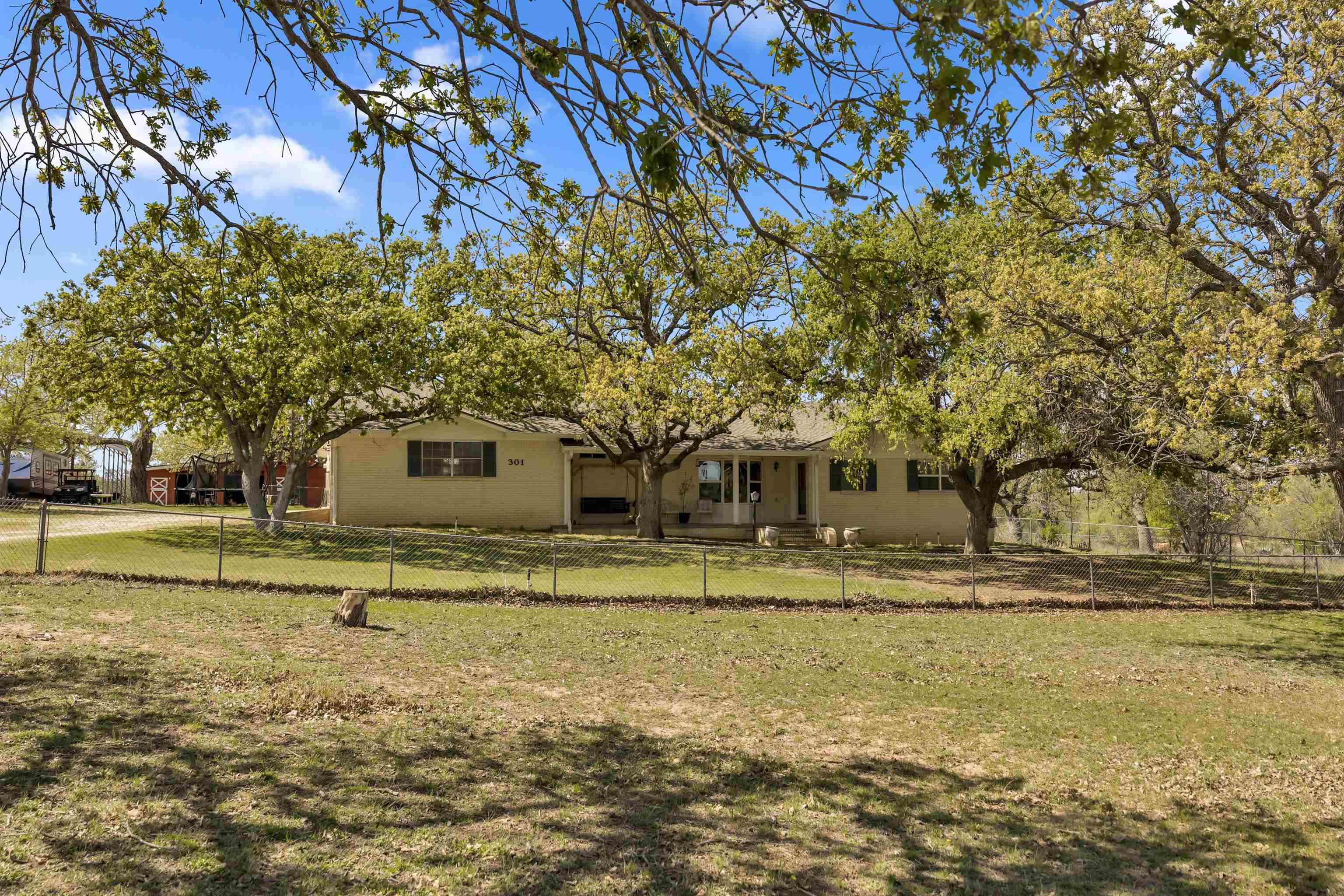 301 Wood Forest Road Kingsland, TX 78639 - Photo 4 of 32 a front view of a house with a yard