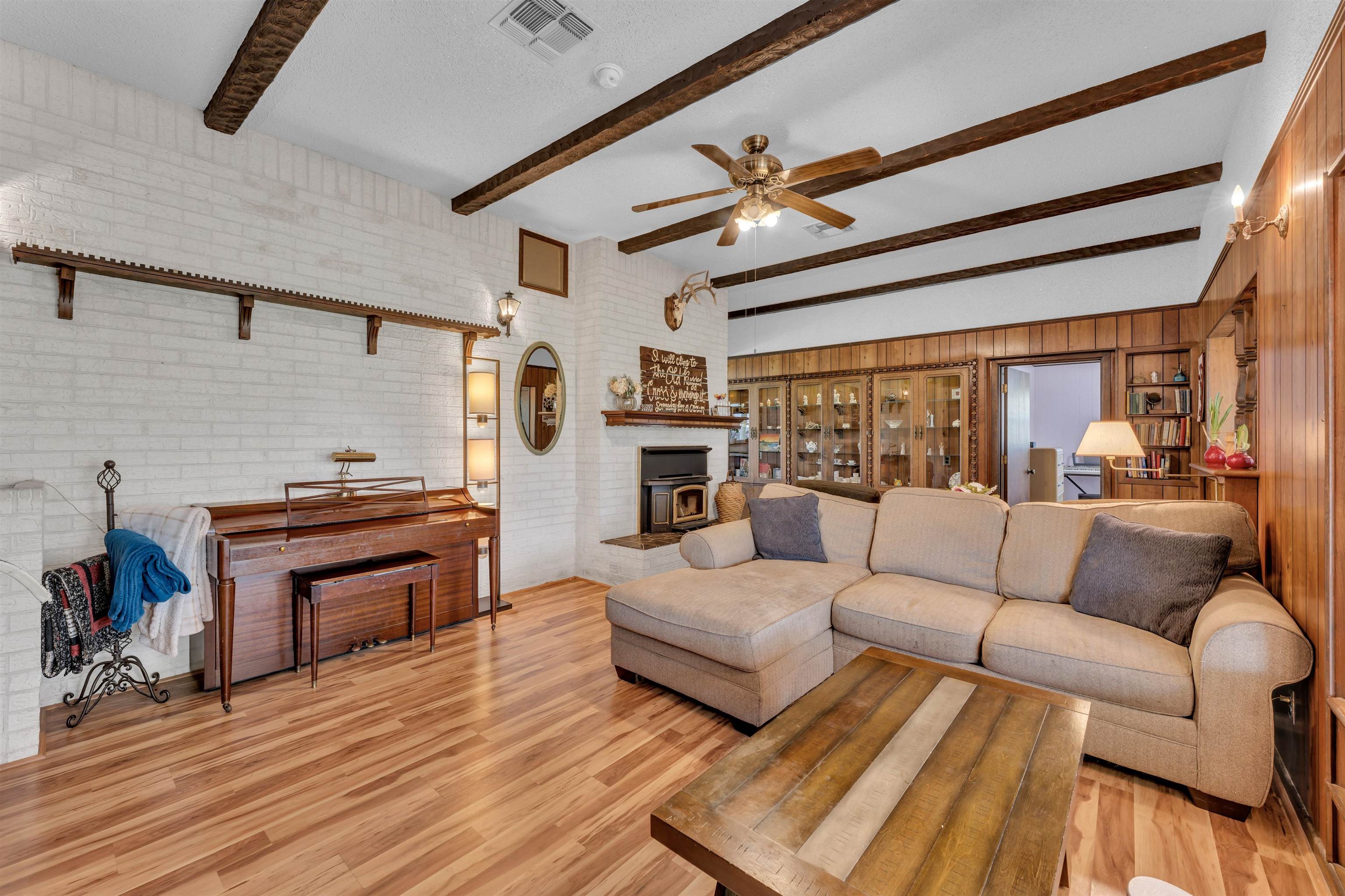 301 Wood Forest Road Kingsland, TX 78639 - Photo 9 of 32 a living room with furniture and a fireplace