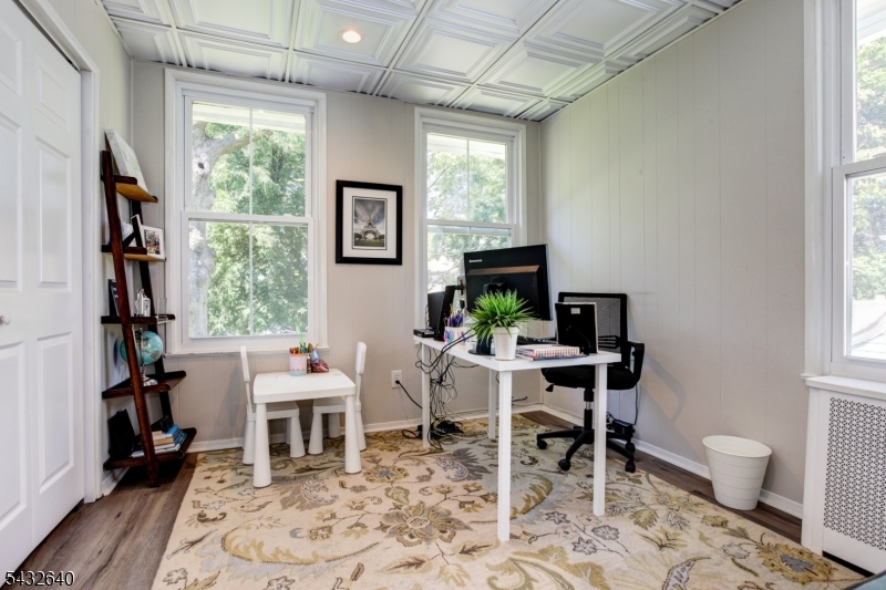 46 Hazelwood Road Bloomfield, NJ 07003 - Photo 9 of 14 a view of a workspace with furniture and a window