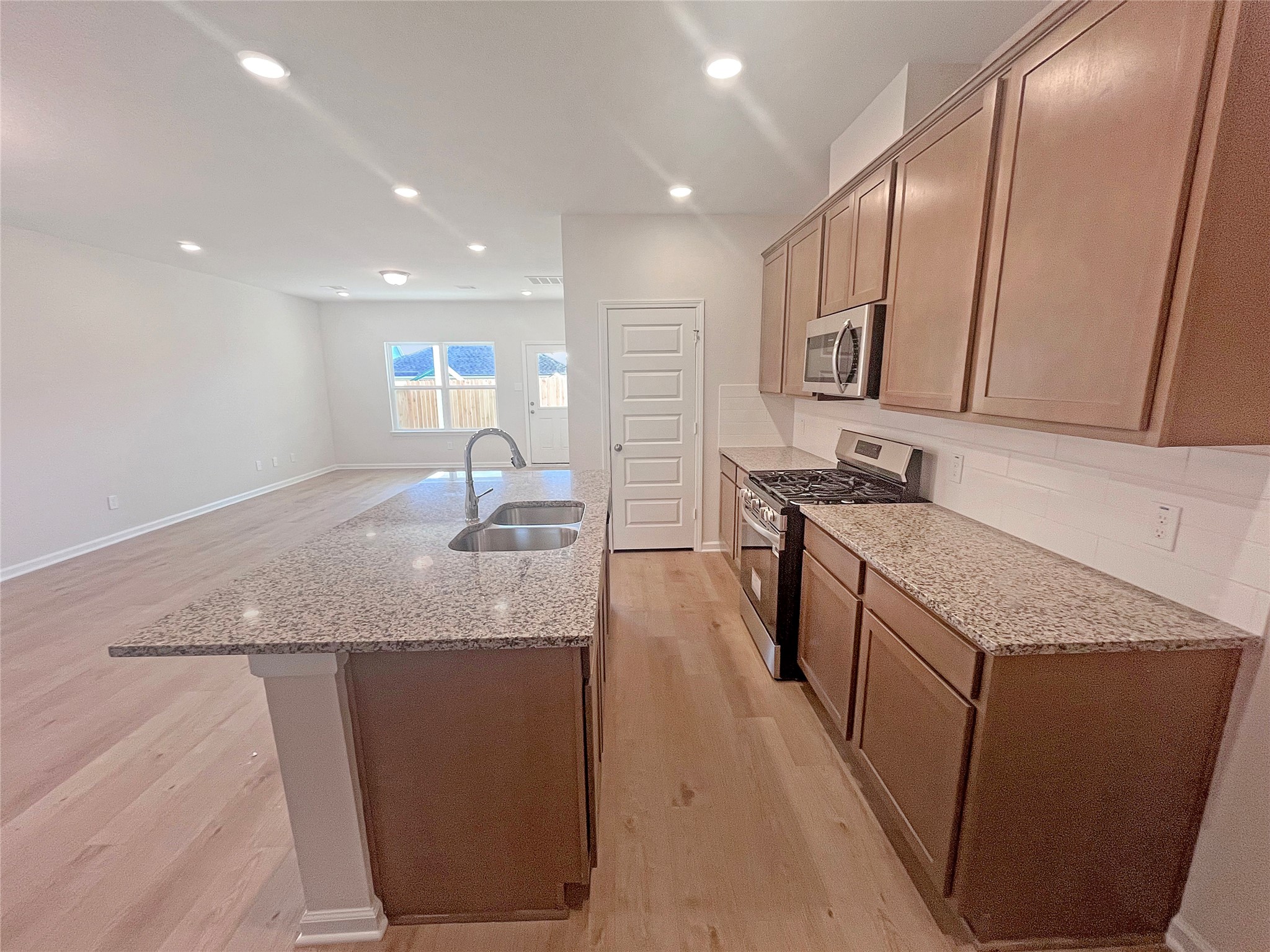 9781 Enclave Ridge Road Willis, TX 77318 - Photo 5 of 24 The Robin II- Kitchen. Sample image to be used for example only, colors, options and upgrades vary.