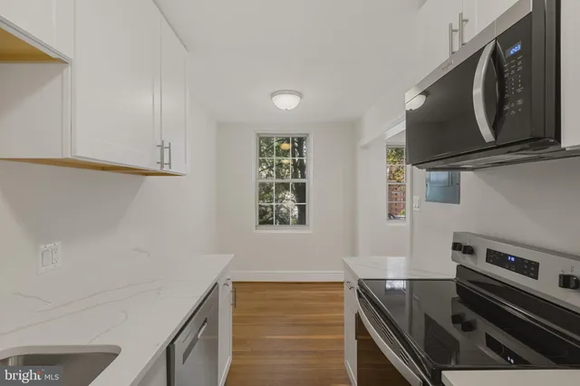 a kitchen with a stove and a microwave