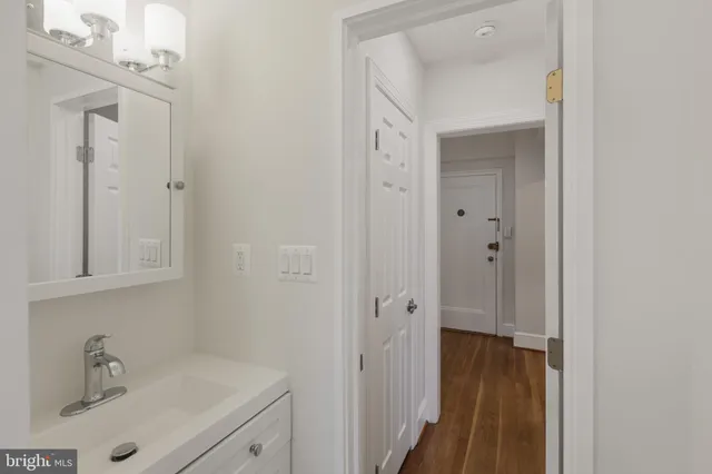 a bathroom with a sink and mirror