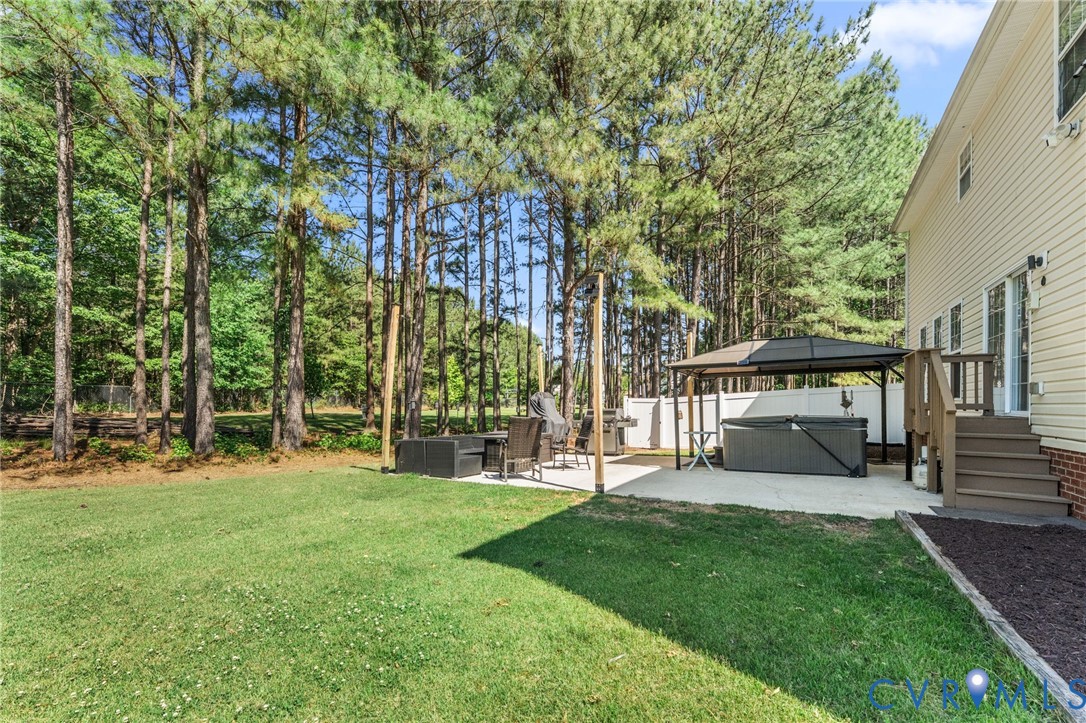 3120 Denise Road Petersburg, VA 23805 - Photo 11 of 51 Expansive backyard featuring a lush lawn, concrete