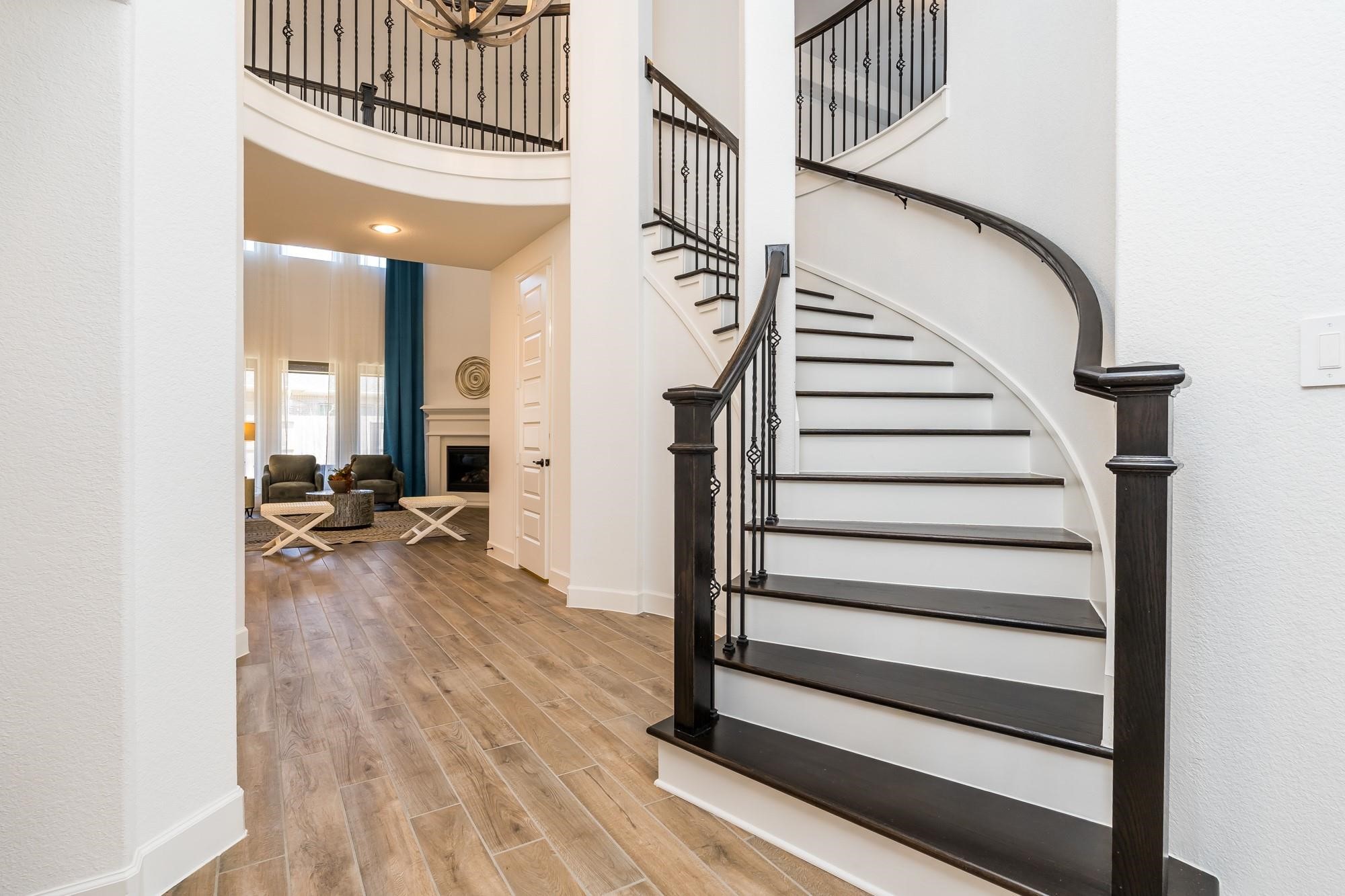 4118 Ana Ridge Lane Fulshear, TX 77441 - Photo 12 of 49 a view of entryway with wooden floor and stairs