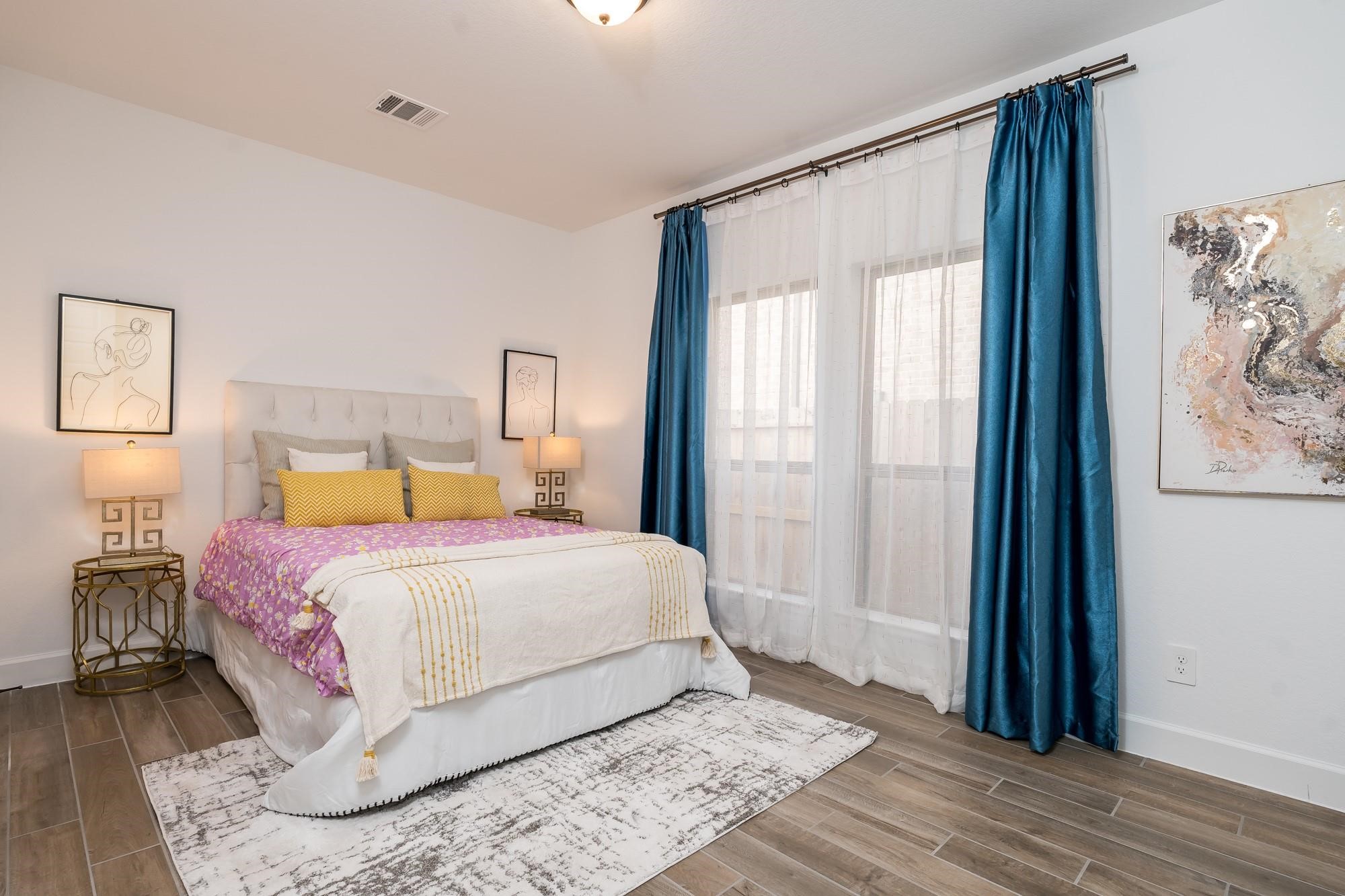 4118 Ana Ridge Lane Fulshear, TX 77441 - Photo 13 of 49 a bedroom with a large bed and a window