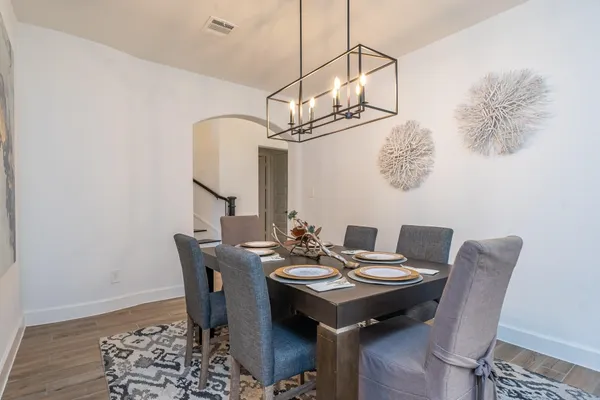 a view of a dining room with furniture and wooden floor
