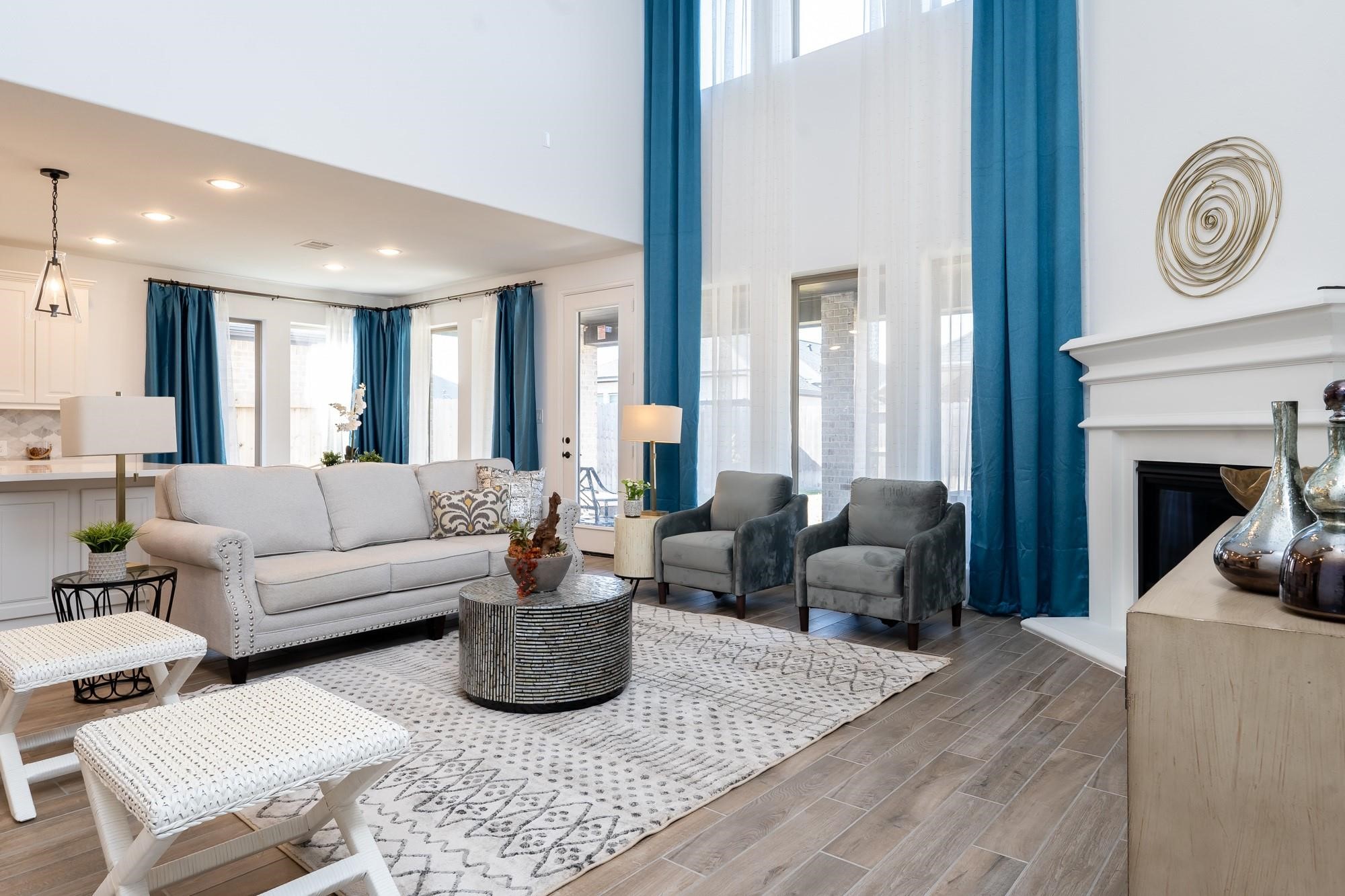 4118 Ana Ridge Lane Fulshear, TX 77441 - Photo 18 of 49 a living room with furniture and a fireplace