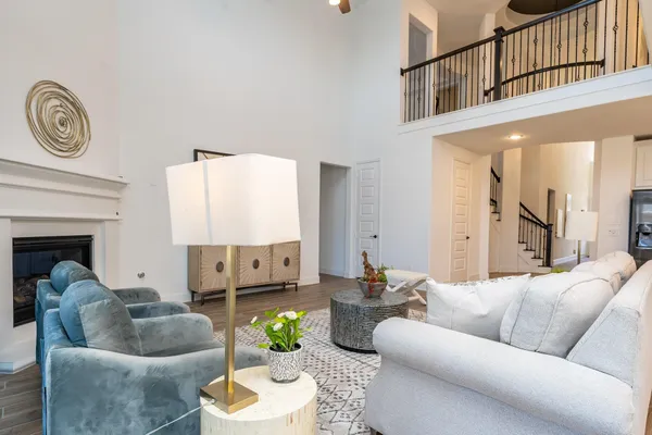 a kitchen with stainless steel appliances granite countertop a table and chairs in it