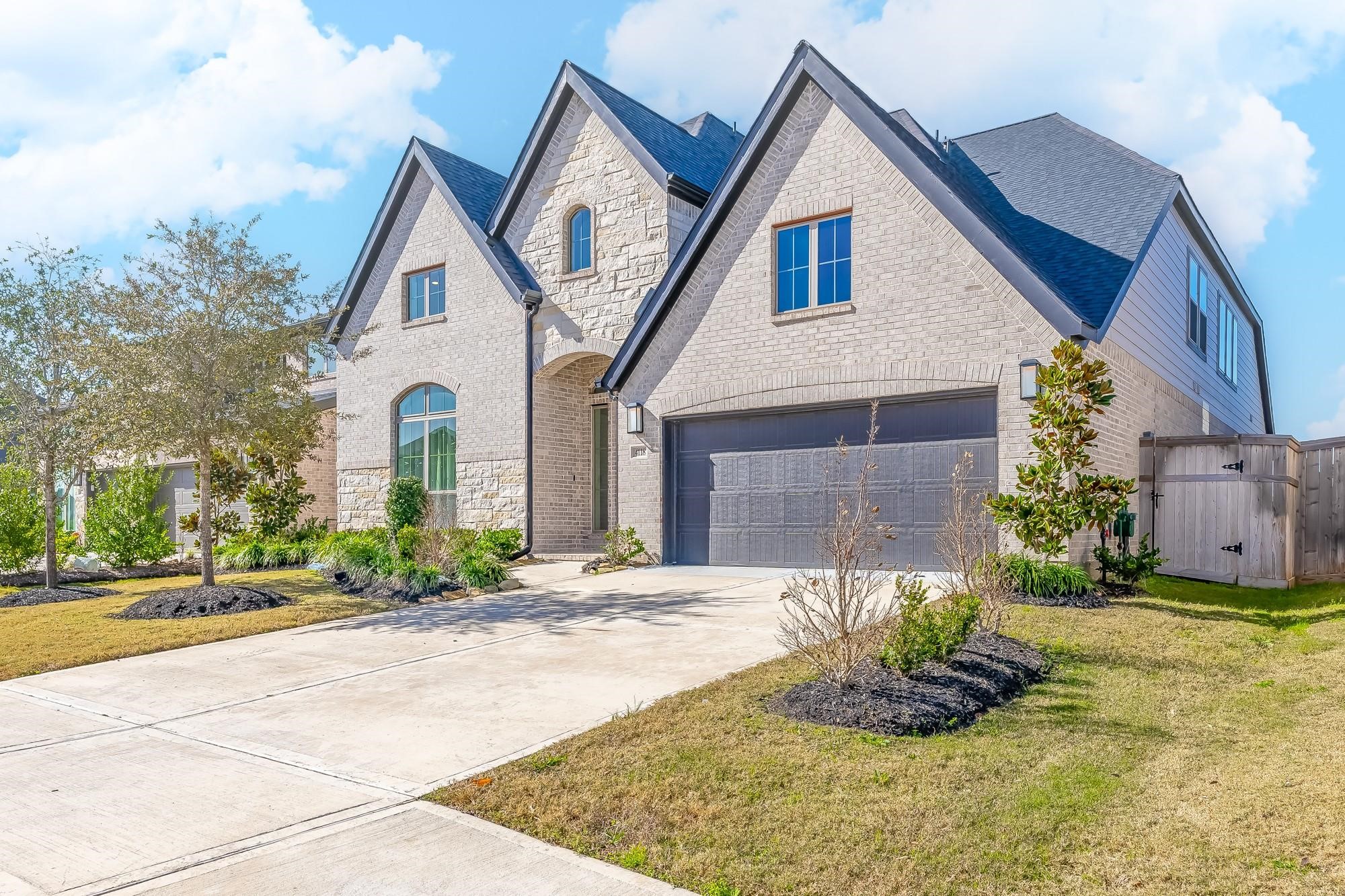 4118 Ana Ridge Lane Fulshear, TX 77441 - Photo 2 of 49 a front view of a house with a yard