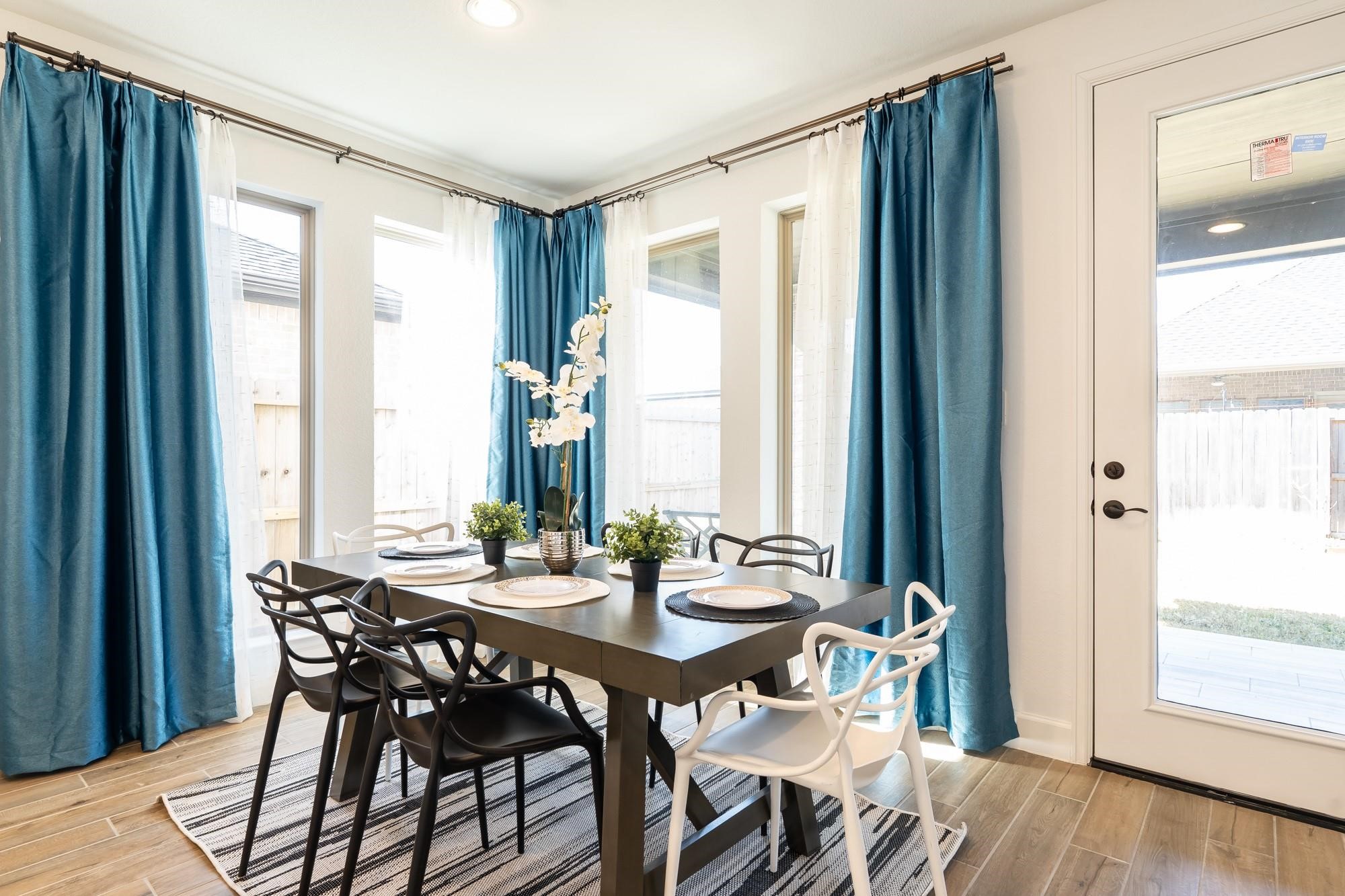 4118 Ana Ridge Lane Fulshear, TX 77441 - Photo 21 of 49 a view of a dining room with furniture and window