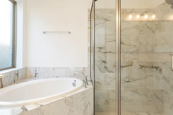 a en suite bathroom with a sink and a mirror