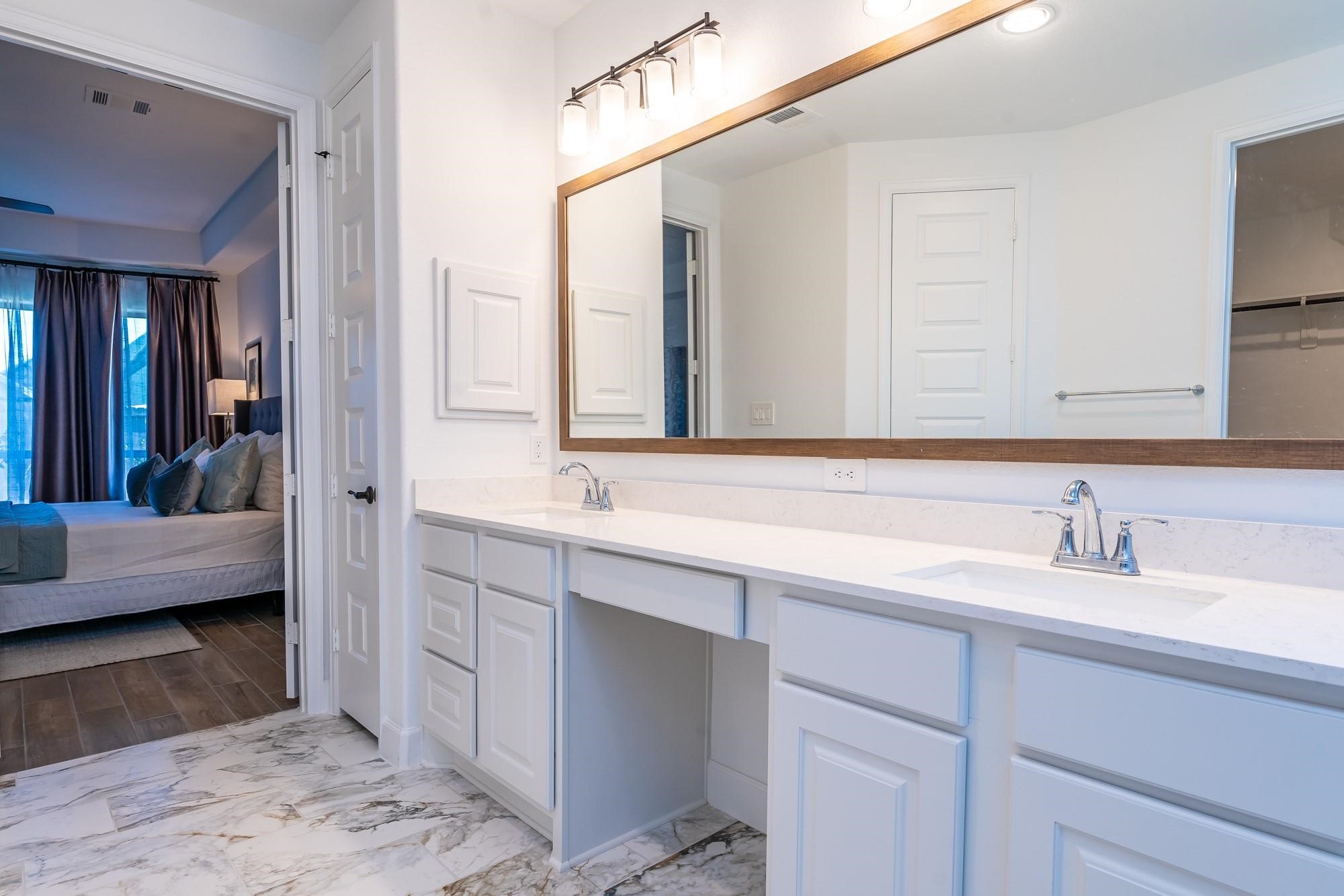 4118 Ana Ridge Lane Fulshear, TX 77441 - Photo 32 of 49 a en suite bathroom with a sink and a mirror
