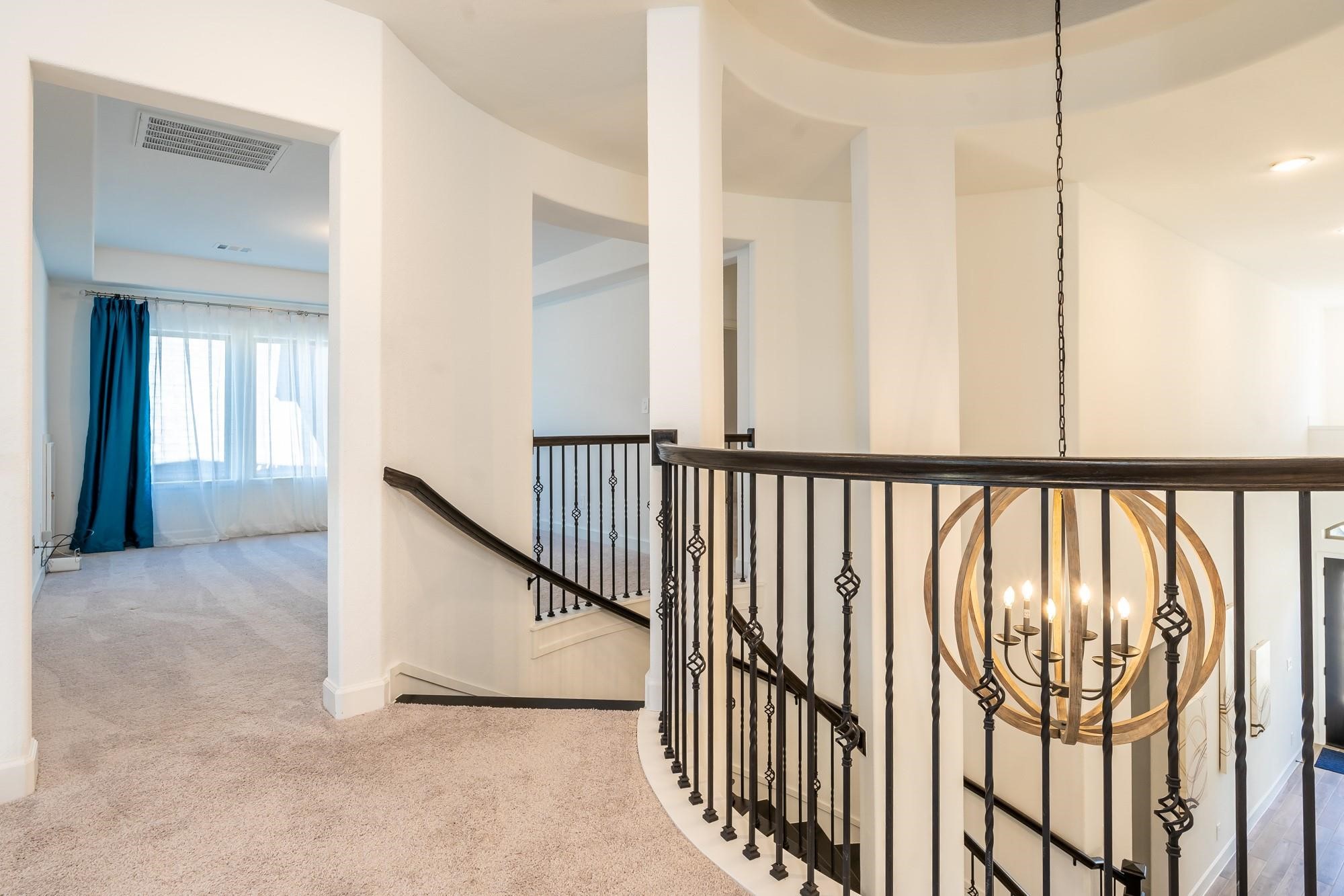 4118 Ana Ridge Lane Fulshear, TX 77441 - Photo 40 of 49 a view of a hallway with wooden floor and staircase