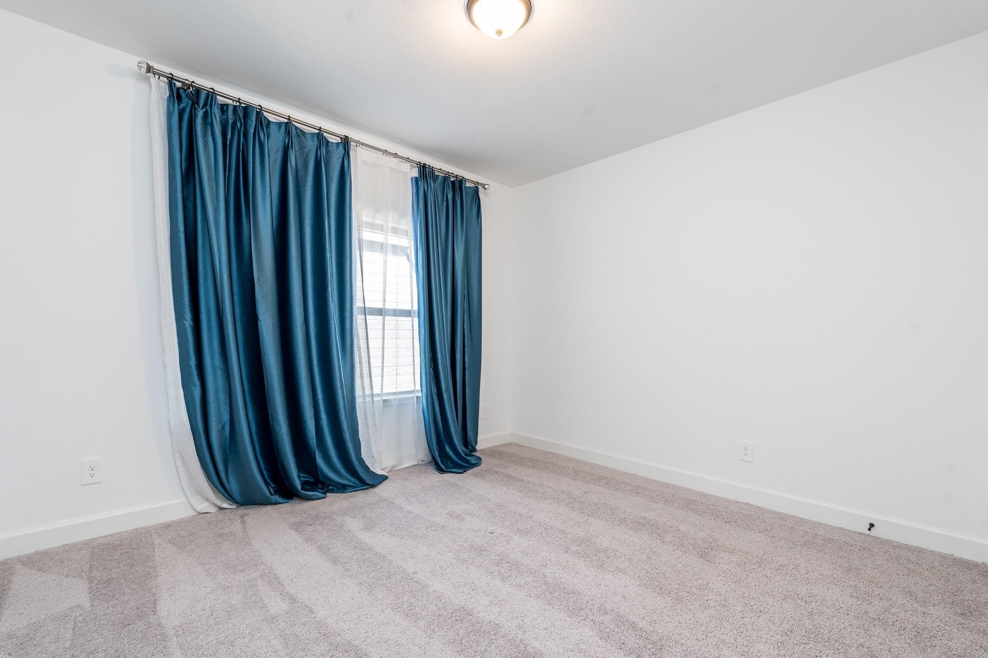 4118 Ana Ridge Lane Fulshear, TX 77441 - Photo 44 of 49 an empty room with windows