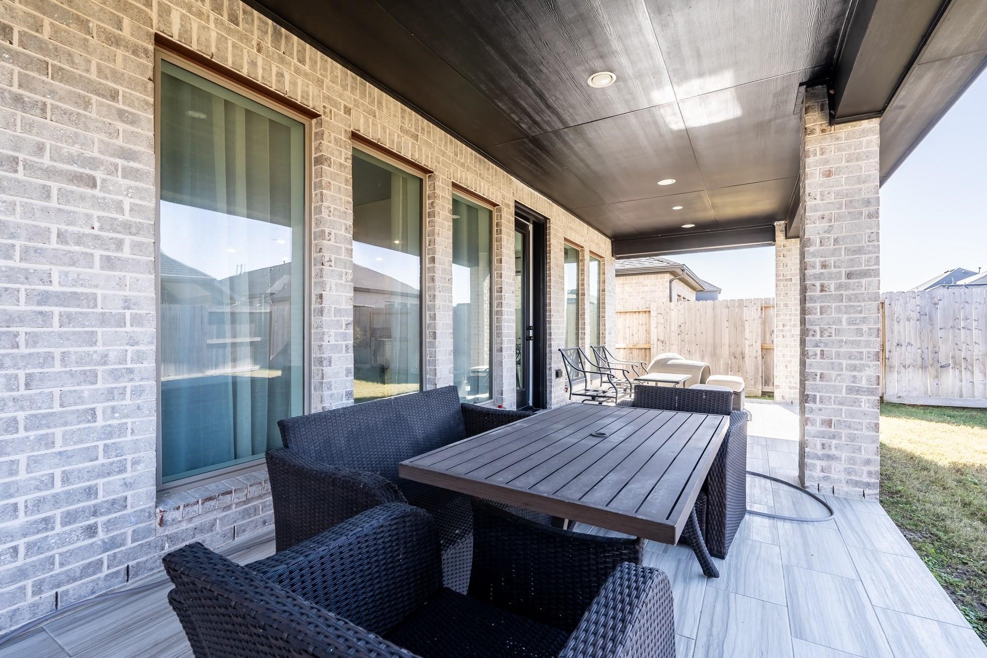 4118 Ana Ridge Lane Fulshear, TX 77441 - Photo 49 of 49 a view of a balcony with furniture and wooden floor