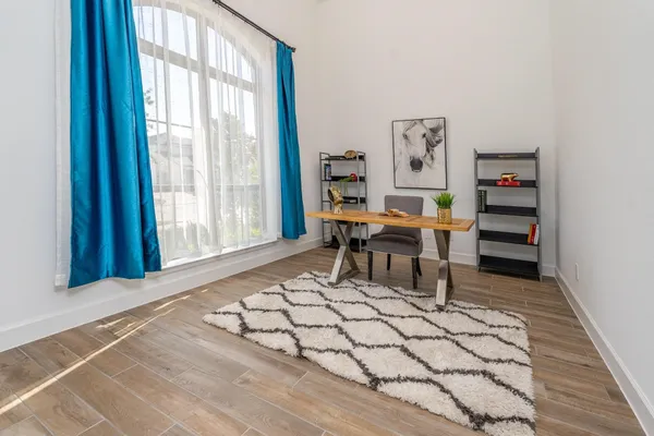 a room with chairs and window