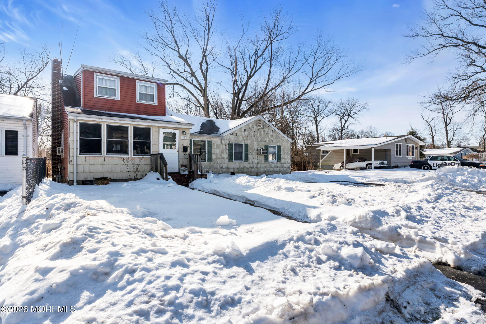 70 Ocean Boulevard Keyport, NJ 07735 - Photo 16 of 20 a front view of a building with a yard covered in snow