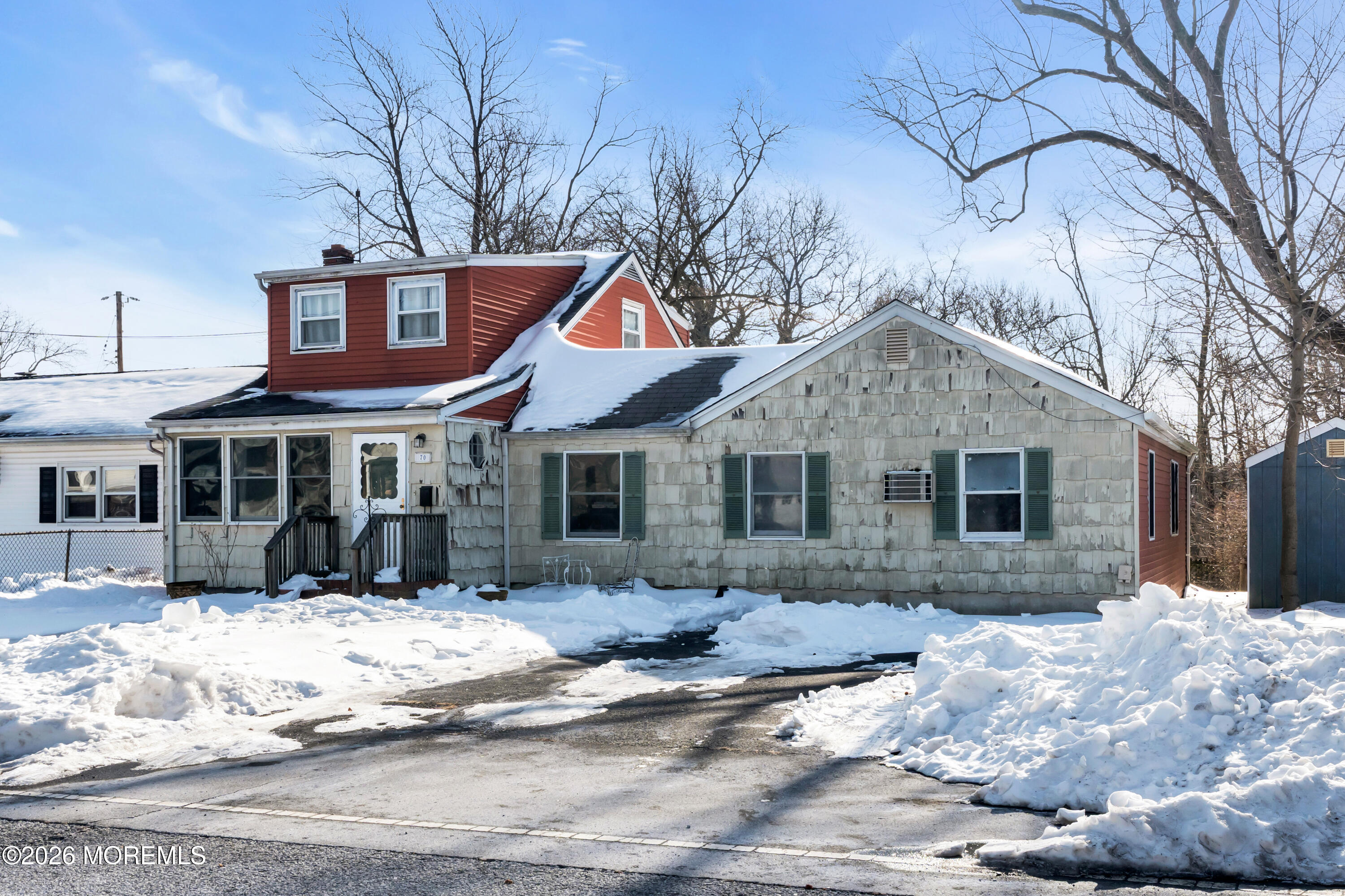 70 Ocean Boulevard Keyport, NJ 07735 - Photo 6 of 20 a front view of a house with a yard covered in snow
