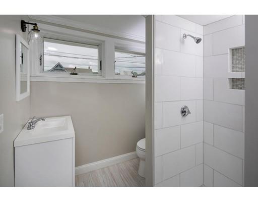 324 Ocean Street Marshfield, MA 02050 - Photo 11 of 25 a bathroom with a sink a toilet and shower