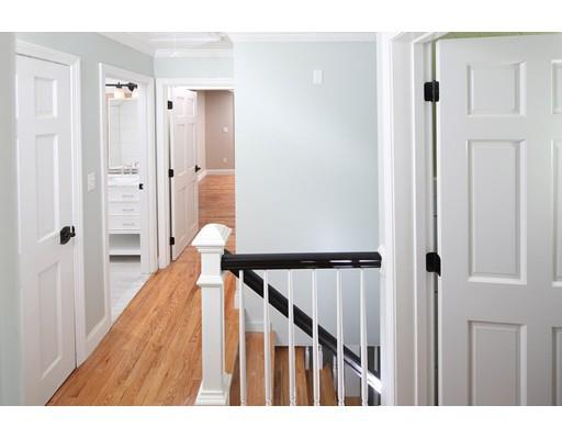 324 Ocean Street Marshfield, MA 02050 - Photo 16 of 25 a view of a hallway with wooden floor and entryway