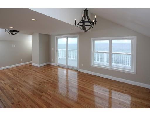 324 Ocean Street Marshfield, MA 02050 - Photo 4 of 25 a view of an empty room with wooden floor and a window