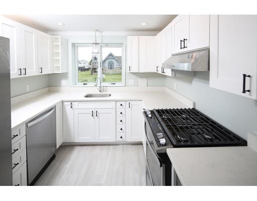 324 Ocean Street Marshfield, MA 02050 - Photo 6 of 25 a kitchen with a sink stove and cabinets