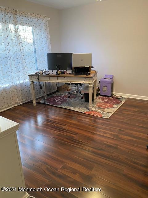 60 County Road, Unit D023 Cliffwood, NJ 07721 - Photo 28 of 36 a living room with furniture and a wooden floor