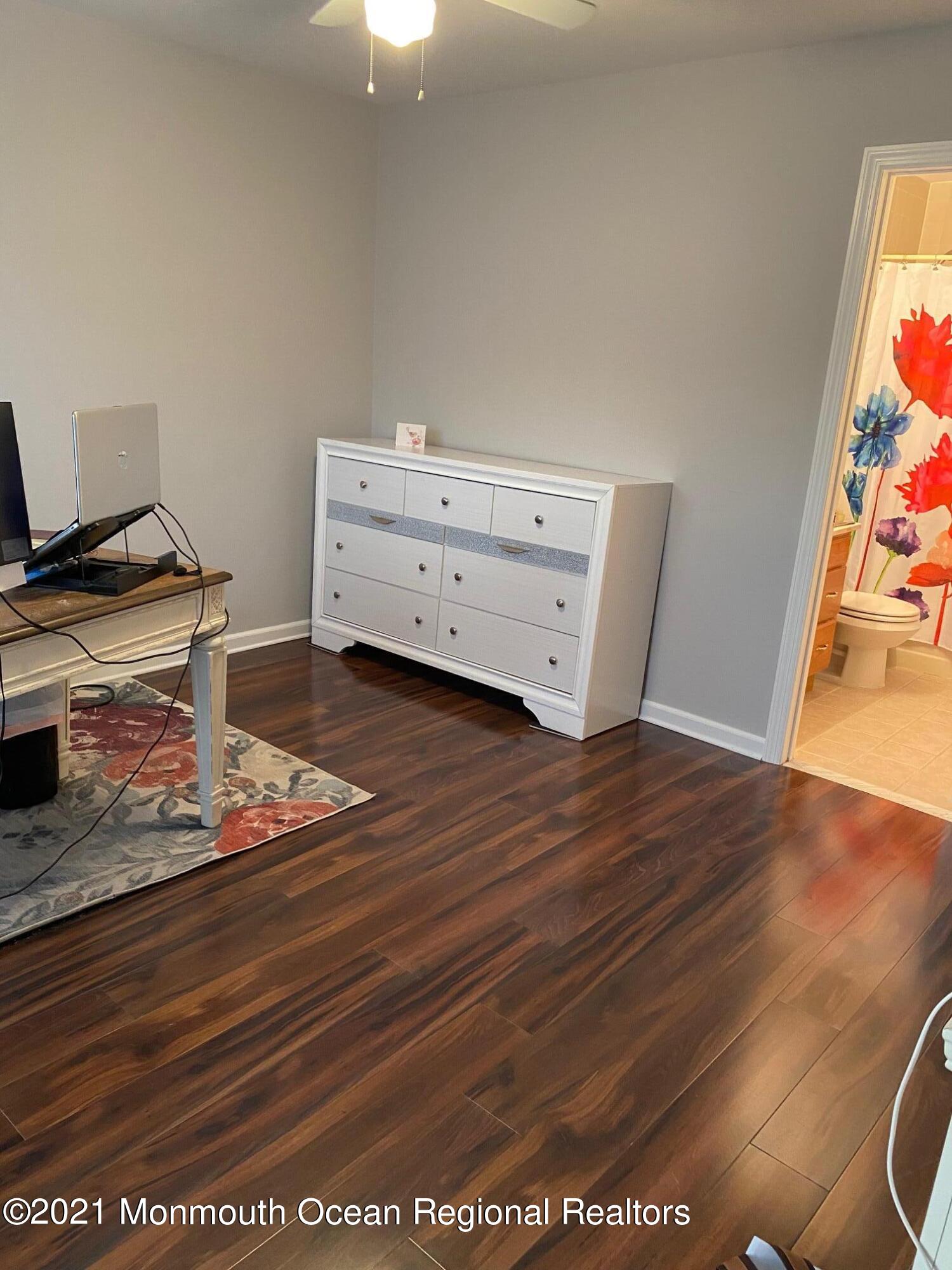 60 County Road, Unit D023 Cliffwood, NJ 07721 - Photo 30 of 36 a view of room with wooden floor