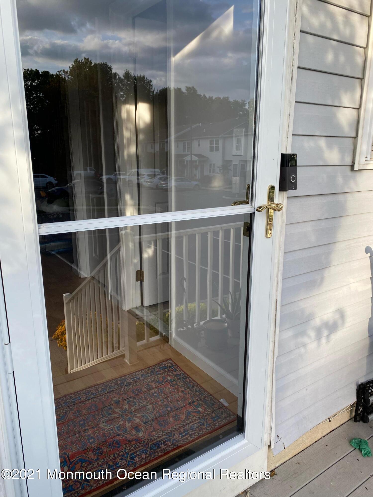 60 County Road, Unit D023 Cliffwood, NJ 07721 - Photo 4 of 36 a view of a balcony with a glass door