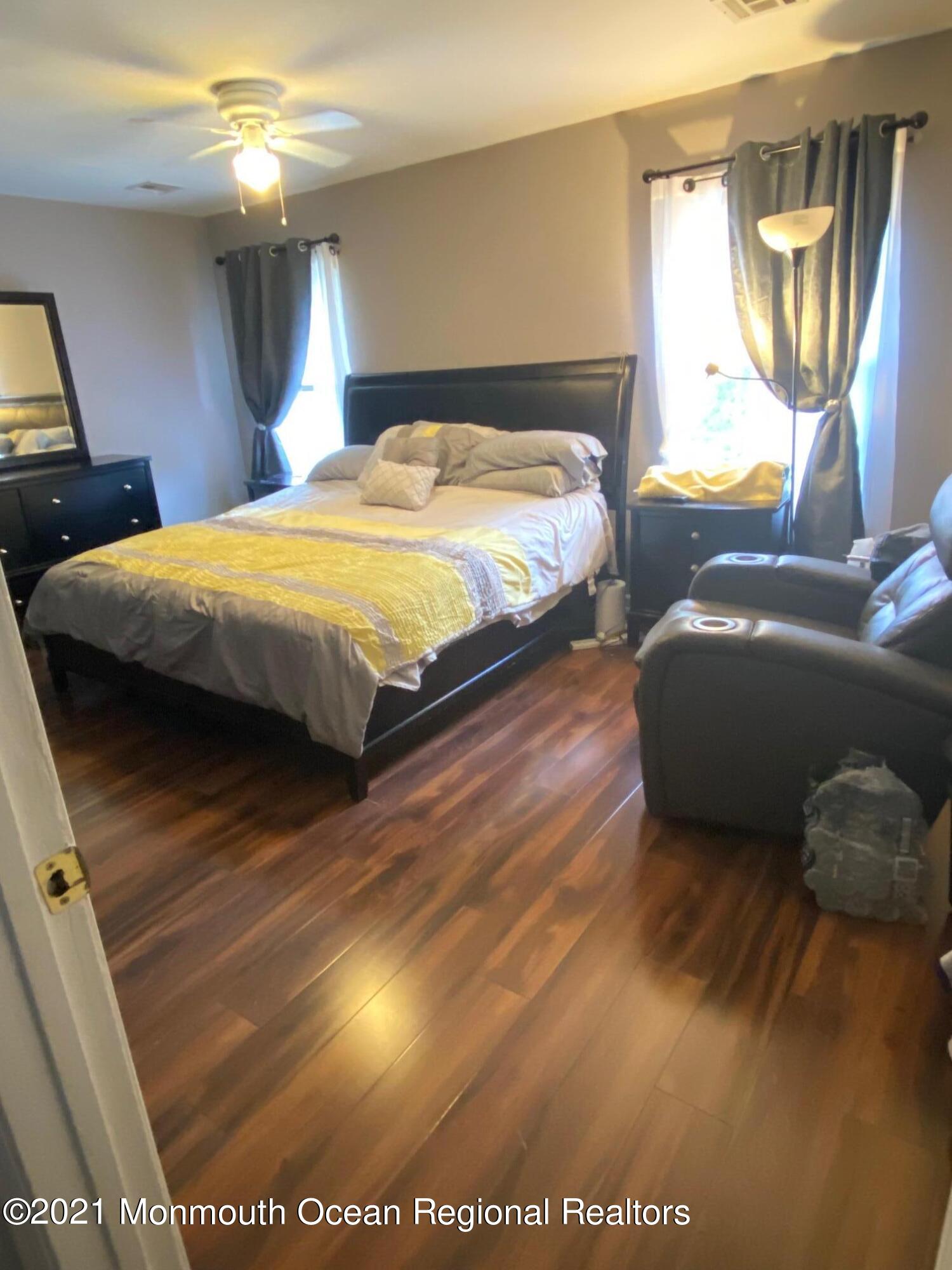 60 County Road, Unit D023 Cliffwood, NJ 07721 - Photo 32 of 36 a bedroom with a bed and window