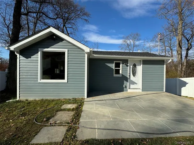 a front view of a house with yard