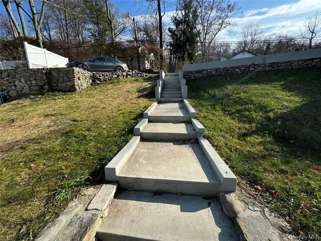 a view of swimming pool with chairs