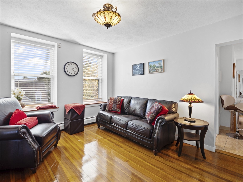 95 Florida Street, Unit 2 Boston, MA 02124 - Photo 8 of 29 a living room with furniture and a large window