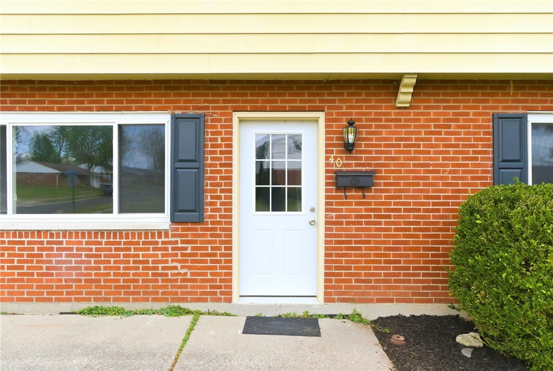40 Woods Road Springboro, OH 45066 - Photo 3 of 57 This charming residence features a classic brick exterior and welcoming entryway.