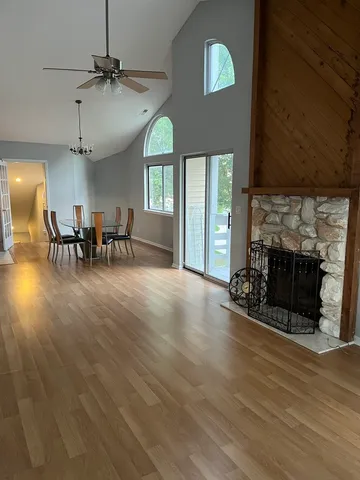 a view of a livingroom with furniture and a fireplace
