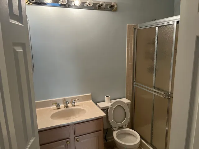a bathroom with a toilet and a sink