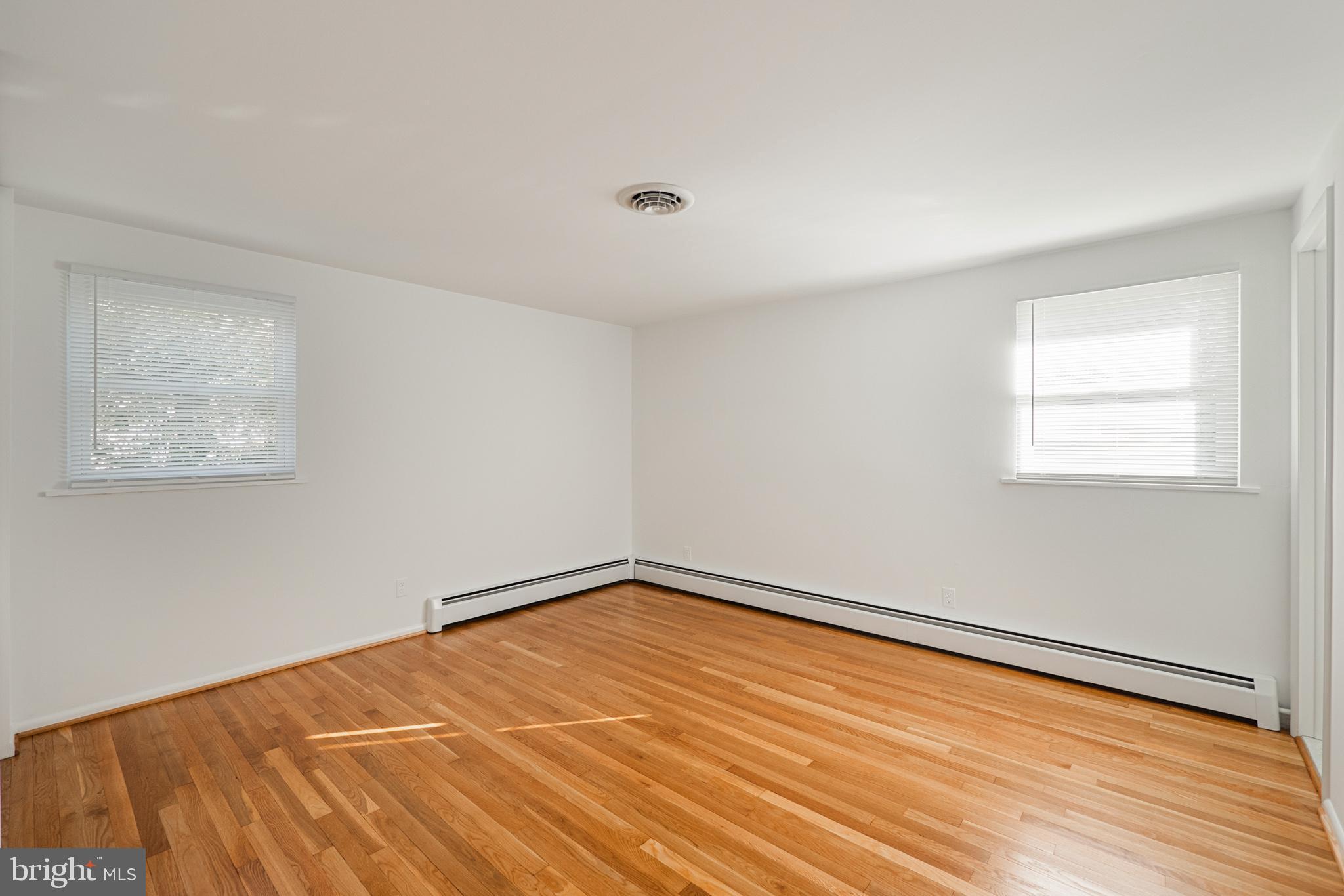 423 Bathurst Road Baltimore, MD 21228 - Photo 13 of 30 Master bedroom with refinished hardwood flooring