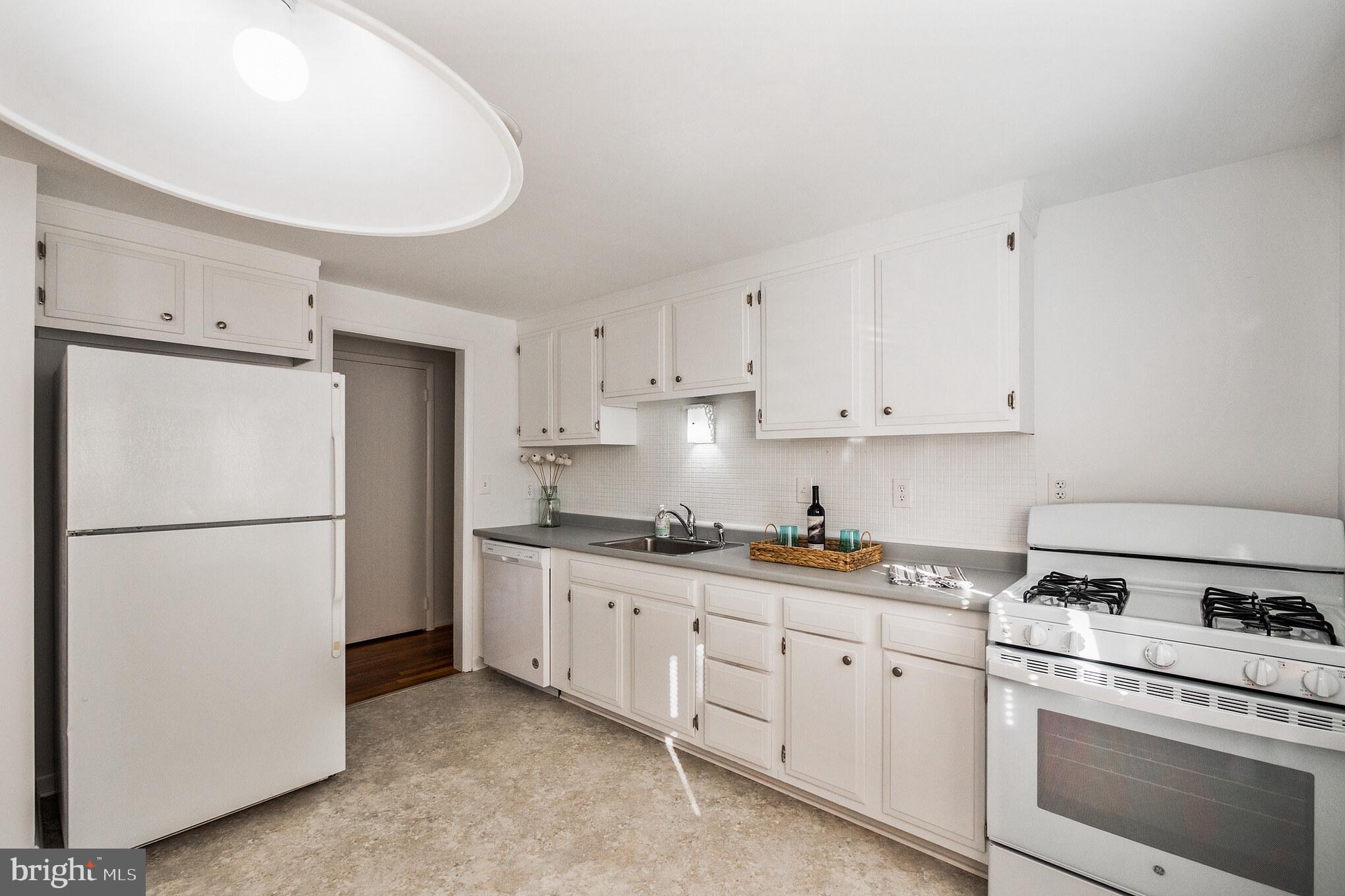 423 Bathurst Road Baltimore, MD 21228 - Photo 3 of 30 Spacious Kitchen with new dishwasher and gas stove
