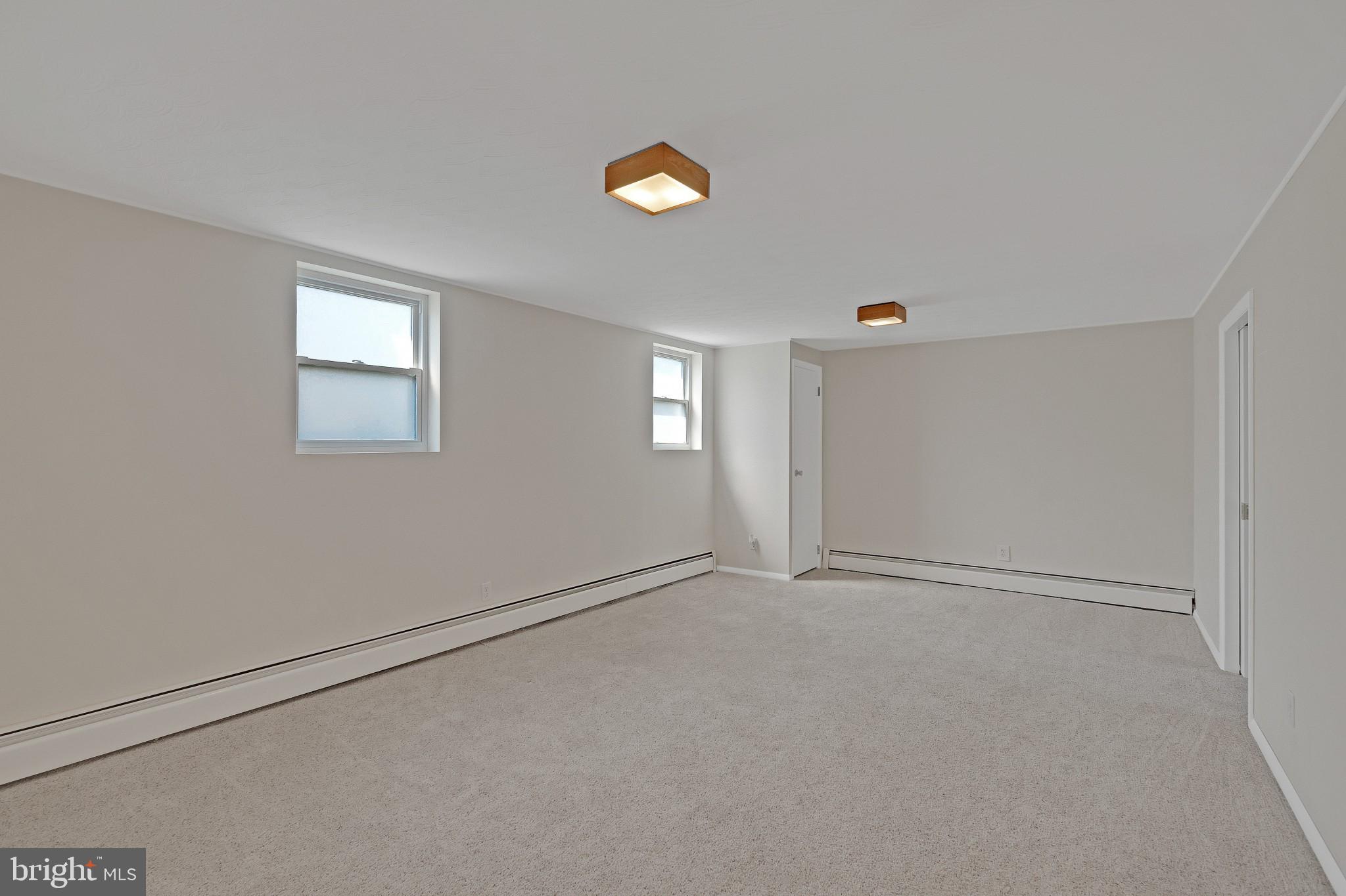 423 Bathurst Road Baltimore, MD 21228 - Photo 6 of 30 Family room with new carpeting