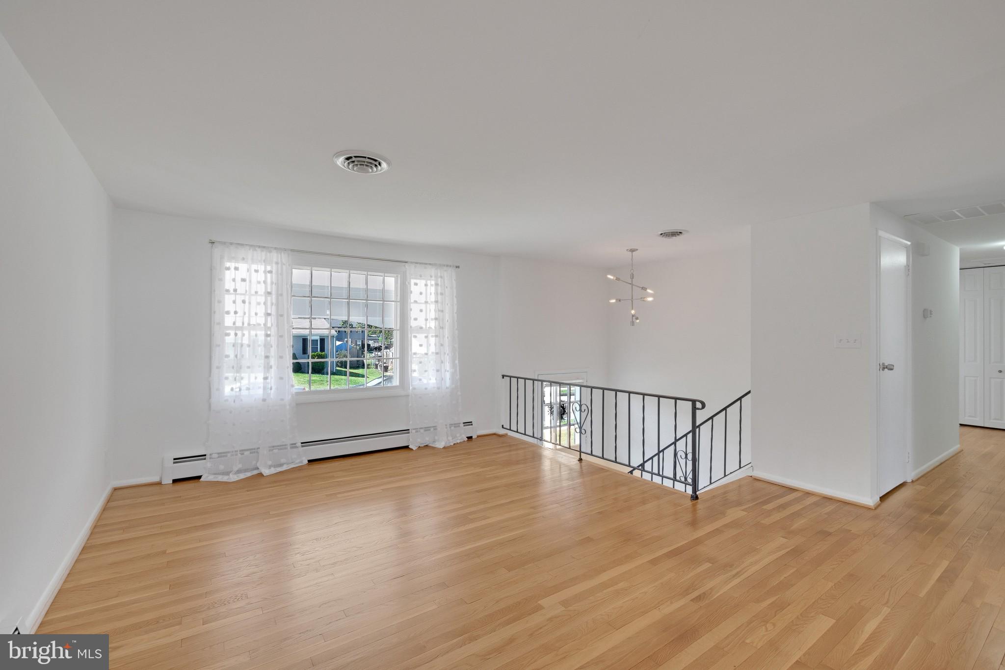 423 Bathurst Road Baltimore, MD 21228 - Photo 8 of 30 Living room with refinished hardwood floors