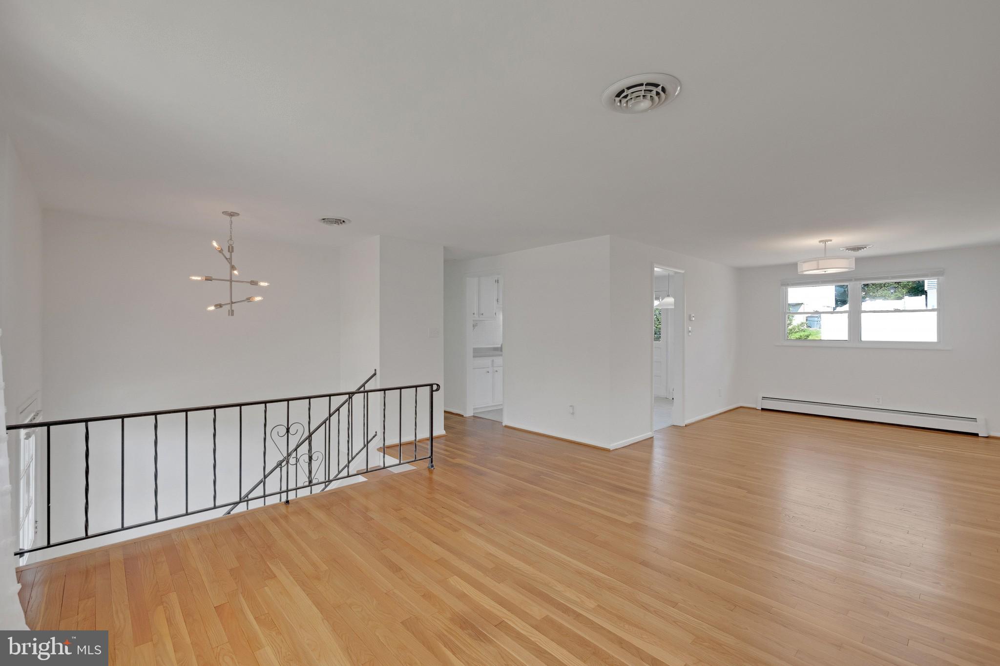 423 Bathurst Road Baltimore, MD 21228 - Photo 9 of 30 Living & dining rooms - refinished hardwood floors