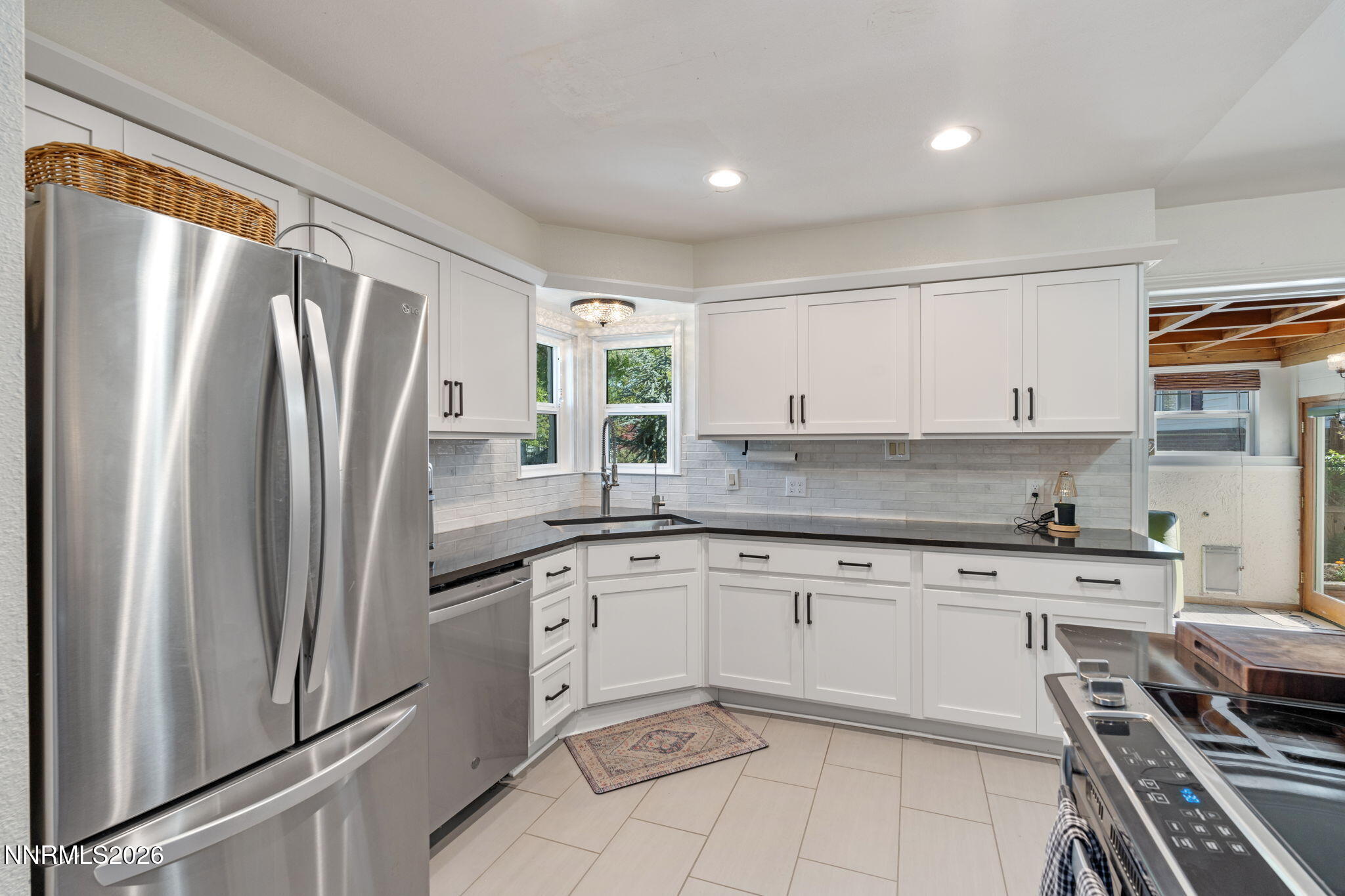 300 Country Club Drive Reno, NV 89509 - Photo 17 of 48 a kitchen with stainless steel appliances granite countertop a refrigerator and a stove top oven
