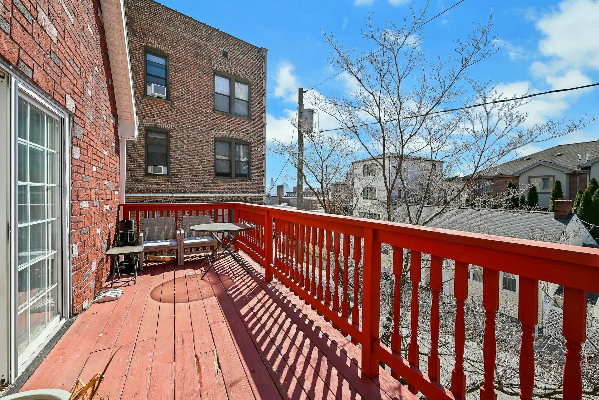30 Columbia Terrace, Unit 2 Edgewater, NJ 07020 - Photo 11 of 25 a view of balcony with wooden floor and outdoor seating