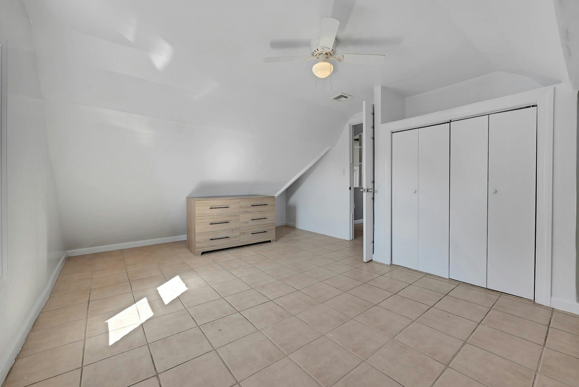 30 Columbia Terrace, Unit 2 Edgewater, NJ 07020 - Photo 15 of 25 an empty room with a ceiling fan