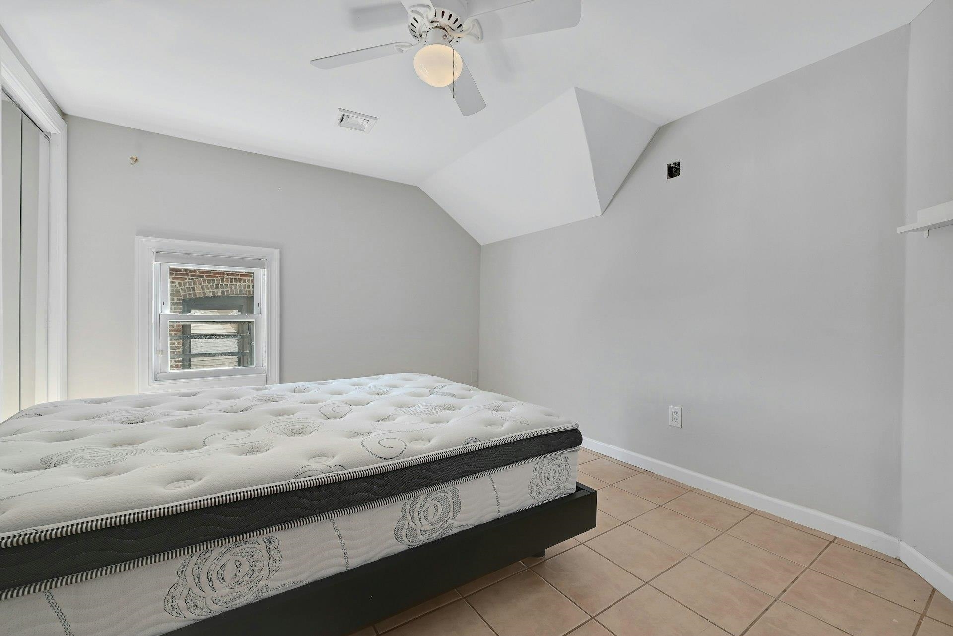 30 Columbia Terrace, Unit 2 Edgewater, NJ 07020 - Photo 16 of 25 a bedroom with a bed and a window