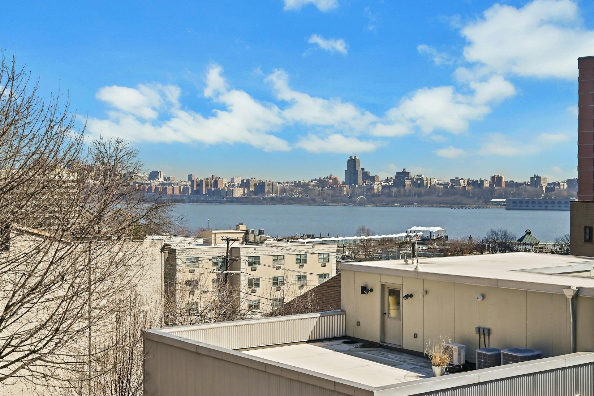 30 Columbia Terrace, Unit 2 Edgewater, NJ 07020 - Photo 21 of 25 a view of a building with outdoor space and seating