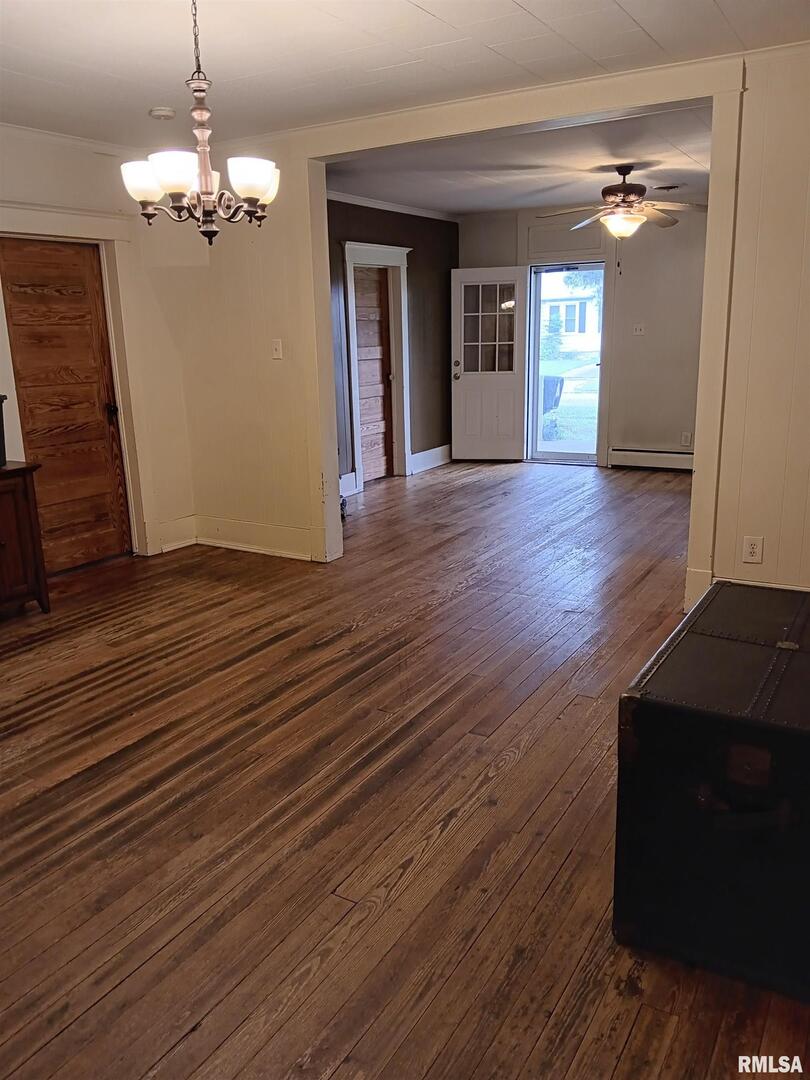 1935 Elm Street Murphysboro, IL 62966 - Photo 2 of 23 a view of a livingroom with wooden floor and a chandelier