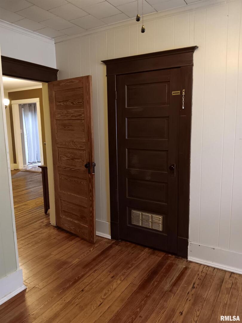1935 Elm Street Murphysboro, IL 62966 - Photo 21 of 23 an empty room with wooden floor and closet